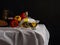 Panorama-still life with olive oil and pepper on a dark background