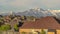 Panorama Stunning view of a snow covered mountain with houses and trees in the foreground