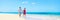 Panorama summer vacation couple walking on beach