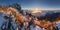 Panorama of sunset in a Carpathian mountain valley with wonderful gold light on a hills