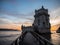 Panorama sunset view of medieval historic defense fortification bastion Torre Belem Tower in Tagus river Lisbon Portugal