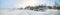 Panorama of Swedish farm on misty winter day