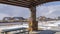 Panorama Tables and benches inside a pavilion at a snowy park on a sunny winter day