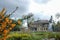 Panorama taken on a cloudy spring day of Pinner Memorial Park, UK, West House and the Heath Robinson Museum in the background.