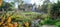 Panorama taken on a sunny spring day of Pinner Memorial Park, UK, West House and the Heath Robinson Museum in the background.
