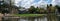 Panorama taken on a sunny spring day of Pinner Memorial Park, UK, West House and the Heath Robinson Museum in the background.