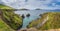 Panorama of tall cliffs, turquoise water and islands at Dunquin Pier, Dingle