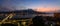 Panorama of the Tamsui and Bali districts along the river in New Taipei City at sunset with a crescent moon and the planet Venus r