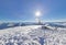 Panorama tattered flag on top of the mountain under sun