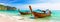 Panorama of thai traditional wooden longtail boat and beautiful sand beach in Krabi province.