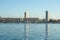 Panorama of Toulon port with sailboats, ships and boats anchored on a Pier with the residential skyscrapers of Mourillon in backgr