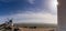 Panorama of traditional whitewashed Spanish windmills in La Mancha on a hilltop above Consuegra with a sun star