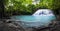 Panorama of tropical forest, waterfall and small pond