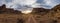 Panorama of a two track dirt road heading into the sunset of Canyonlands National Park