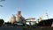 Panorama of unloading grain trucks at elevator on elevating hydraulic platform unloader. Grain crops transshipment at