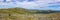Panorama of the Ural Mountains with huge boulders on the hillsides. Beautiful summer landscape in good weather
