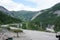 A panorama of the valley of the Irkut river from the tract, reaching to Mongolia, early on a summer morning