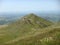 Panorama of the verdant mountains of the Auvergne Vulcanos in France.