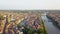 Panorama of Verona historical city centre, bridges across Adige river. Medieval buildings with red tiled roofs, Italy.Aerial video