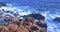 panorama view from above where the sea waves crashes on the rocky coast under a blue sky, concept of holiday, Porto Cesario Lecce