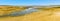 A panorama view across the evaporated lagoon of Fuente de Piedra and breeding flamingos in Spain