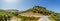 A panorama view across a road junction beneath the hilltop fortress in the town of Montefrio, Spain