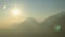 Panorama view of amazing mountainscape, sun shining over mountains, magic hour