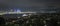 Panorama view of Auckland city at night, with Skytower on the left and Harbour bridge on the right of the image