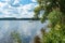 Panorama view of the Baltic Sea on sunny summer day. Rocky shores of Scandinavia covered with evergreen forest. Beautiful canoe