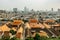 Panorama view of Bangkok from Golden Mountain on cloudy dusty day,Thailand. Traditional Thai architecture from above,modern