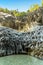 A panorama view of the basalt volcanic columns on a bend in the river flowing through the Alcantara gorge near Taormina, Sicily