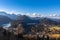 Panorama view of the Bavarian Alps and Lake with the famous Hohenschwangau Castle and Alpsee lake, Schwansee lake on a sunny day