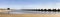 Panorama view of the breakwater in Les Salines beach in Cubelles, Barcelona, Spain.  Mediterranean summer day in Garraf coast