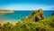 A panorama view of Broad Haven bay with the Church Rock` offshore on the Pembrokeshire coast