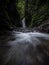 Panorama view of Cascada Colibries waterfall in tropical rain cloud forest Mindo valley jungle Nambillo Ecuador andes