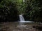 Panorama view of Cascada Ondinas waterfall in tropical rain cloud forest Mindo valley jungle Nambillo Ecuador andes