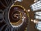 Panorama view of Cecil Brewer spiral staircase stairway hanging lights at Heals store London England Great Britain UK