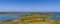 Panorama view of the coastal islands of the Kvarken Archipelago under a blue sky