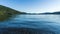 Panorama view Cultus lake against the beautiful big mountain covered with coniferous forest summer landscape