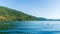Panorama view Cultus lake blue water with clear sky and mountains in the distance summer time