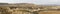 Panorama view of the desert grasslands and mesas and table mountains in the Bardenas Reales desert in northern Spain