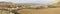 Panorama view of the desert grasslands and mesas and table mountains in the Bardenas Reales desert in northern Spain