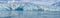 A panorama view in Disenchartment Bay across the snout of the Hubbard Glacier, Alaska