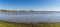 Panorama view of Donana National Park wetlands and El Rocio village and church in the background