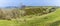 A panorama view down from the northern ramparts of the Iron Age Hill fort remains at Burrough Hill in Leicestershire, UK