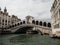 Panorama view of famous white pedestrian stone arch bridge over Grand Canal river in Venice Venezia Veneto Italy Europe