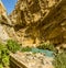 A panorama view of the Gaitanejo river with the Caminito del Rey pathway suspended overhead near Ardales, Spain