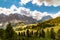 Panorama view of Gardena Pass, Sassolungo, Piz Boe, and Sass dla Luesa, Trentino Alto Adige, Italy. Alpine meadows and Passo