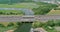 Panorama view on highway traffic of cars driving on freeway across the bridge