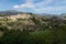 Panorama view of the hills of Polop de Marina with church and castell over green forest at the Costa Blanca, Spain
